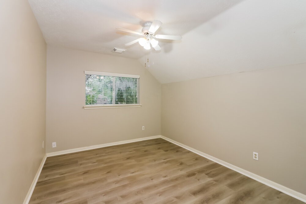 4635 Linden Place Pearland, TX 77584 - Photo 15 of 17 wooden floor in an empty room with a window
