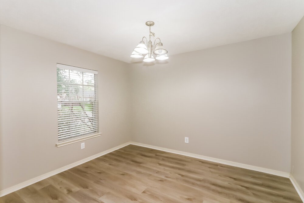 4635 Linden Place Pearland, TX 77584 - Photo 6 of 17 wooden floor in an empty room with a window