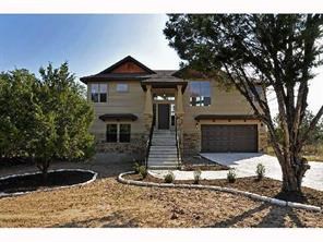 307 Southwind Road Point Venture, TX 78645 - Photo 1 of 1 a front view of a house with a yard