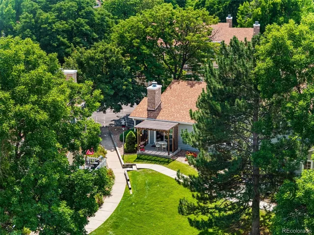an aerial view of a house with swimming pool garden and patio