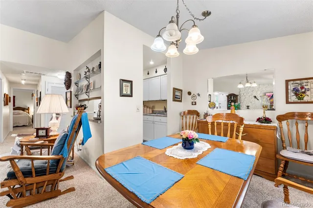 a view of a dining room with furniture and a table