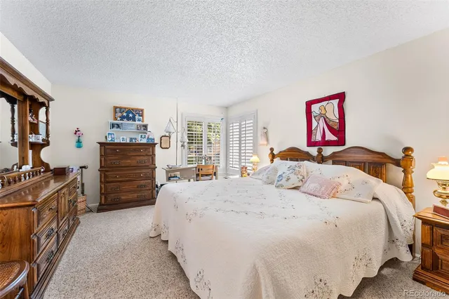 a bedroom with a bed and dresser