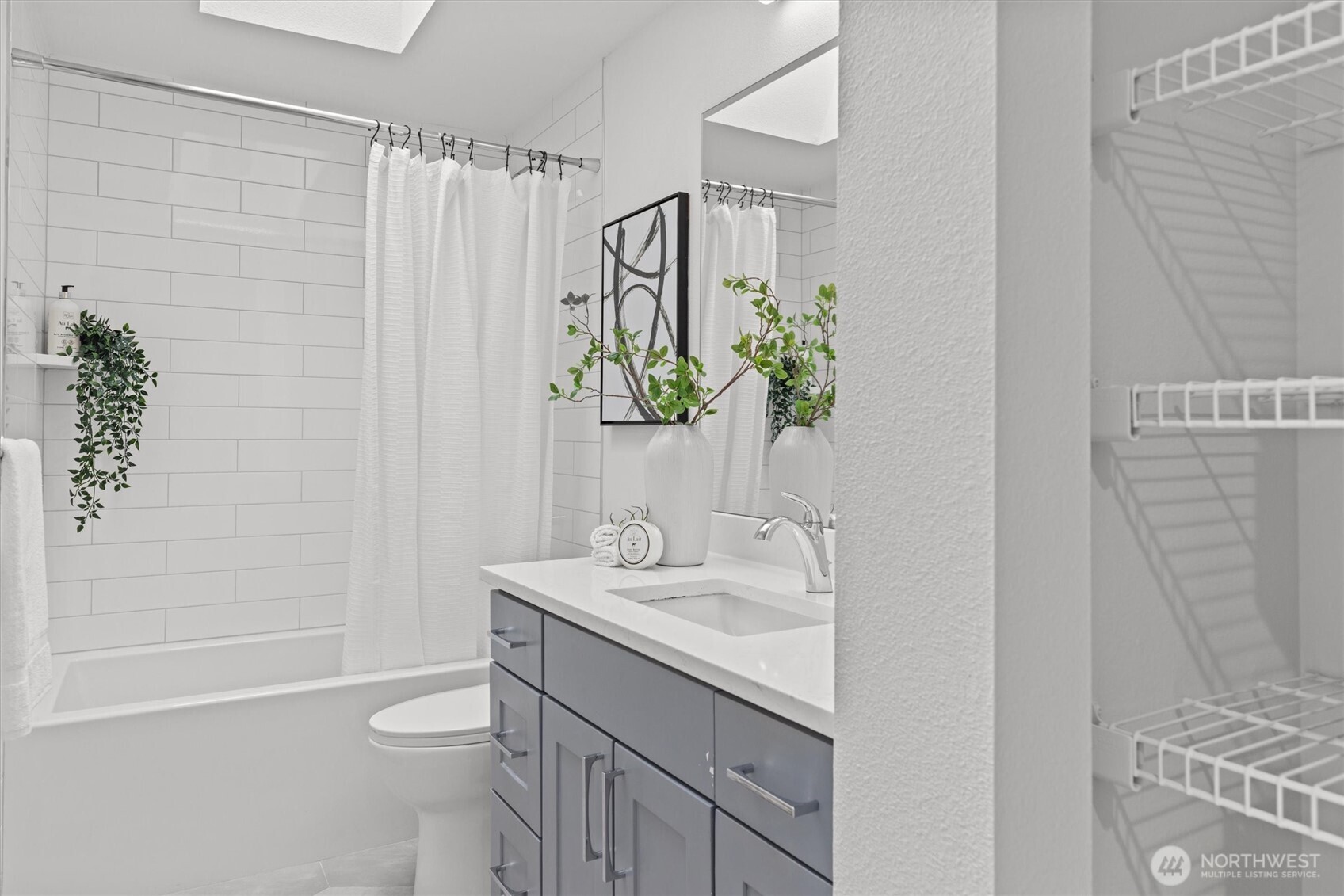 16302 123rd Place Northeast Bothell, WA 98011 - Photo 17 of 37 a bathroom with a granite countertop sink a toilet and shower