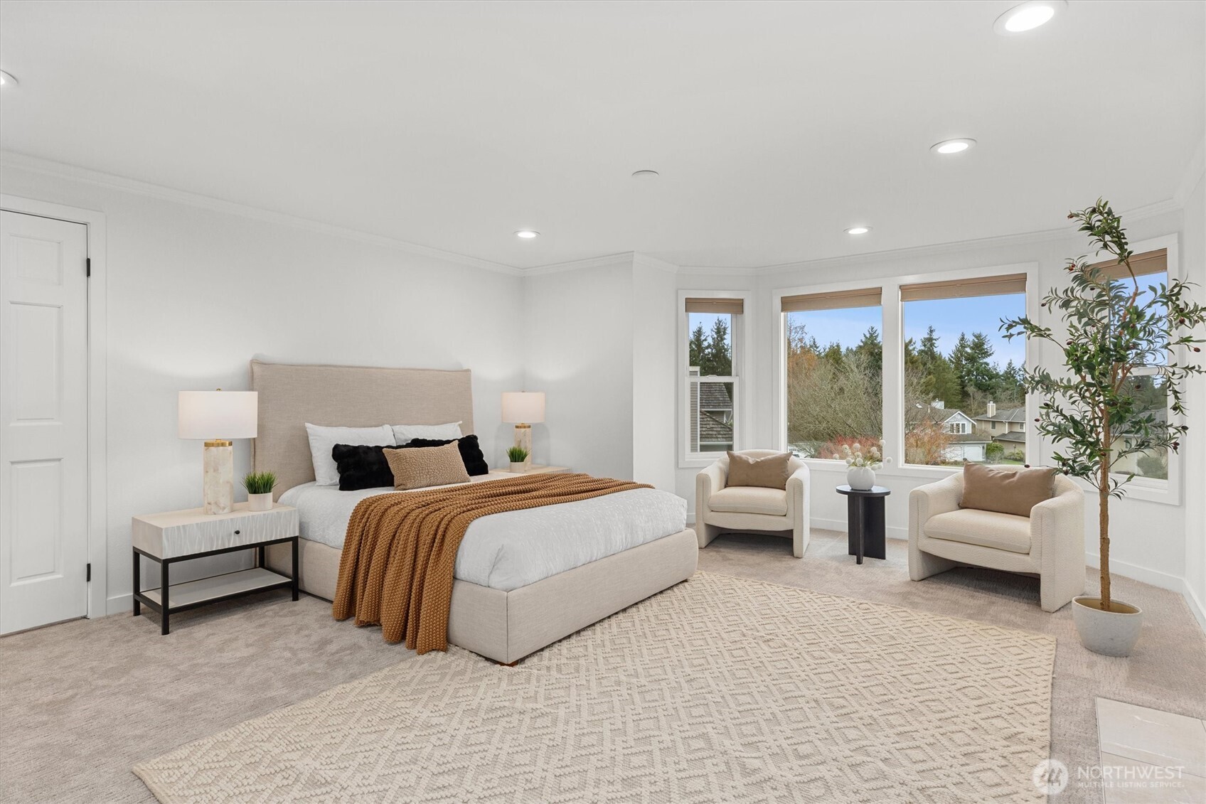 16302 123rd Place Northeast Bothell, WA 98011 - Photo 18 of 37 a spacious bedroom with a bed and large windows