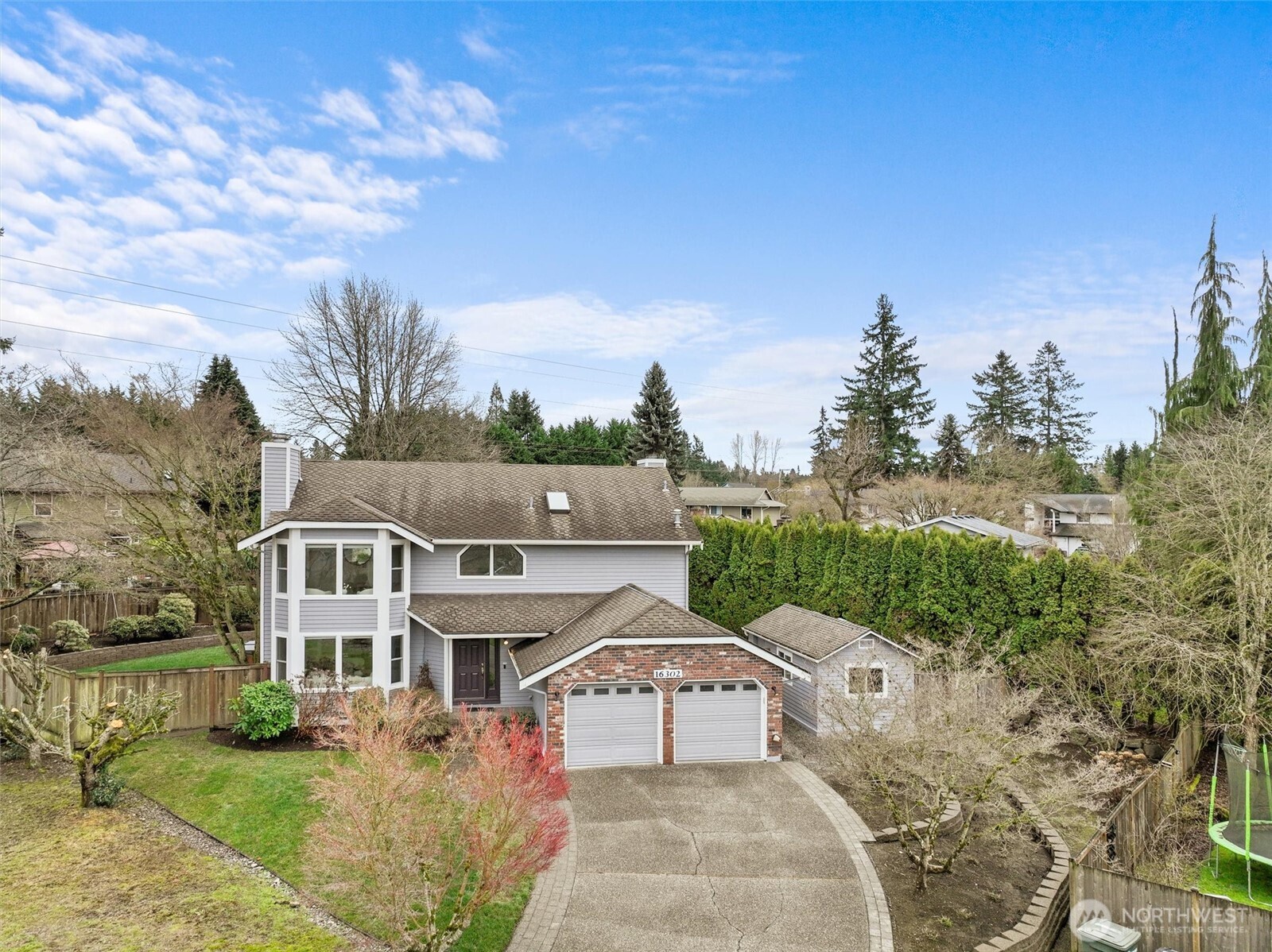 16302 123rd Place Northeast Bothell, WA 98011 - Photo 29 of 37 a view of a white house with a big yard plants and large trees