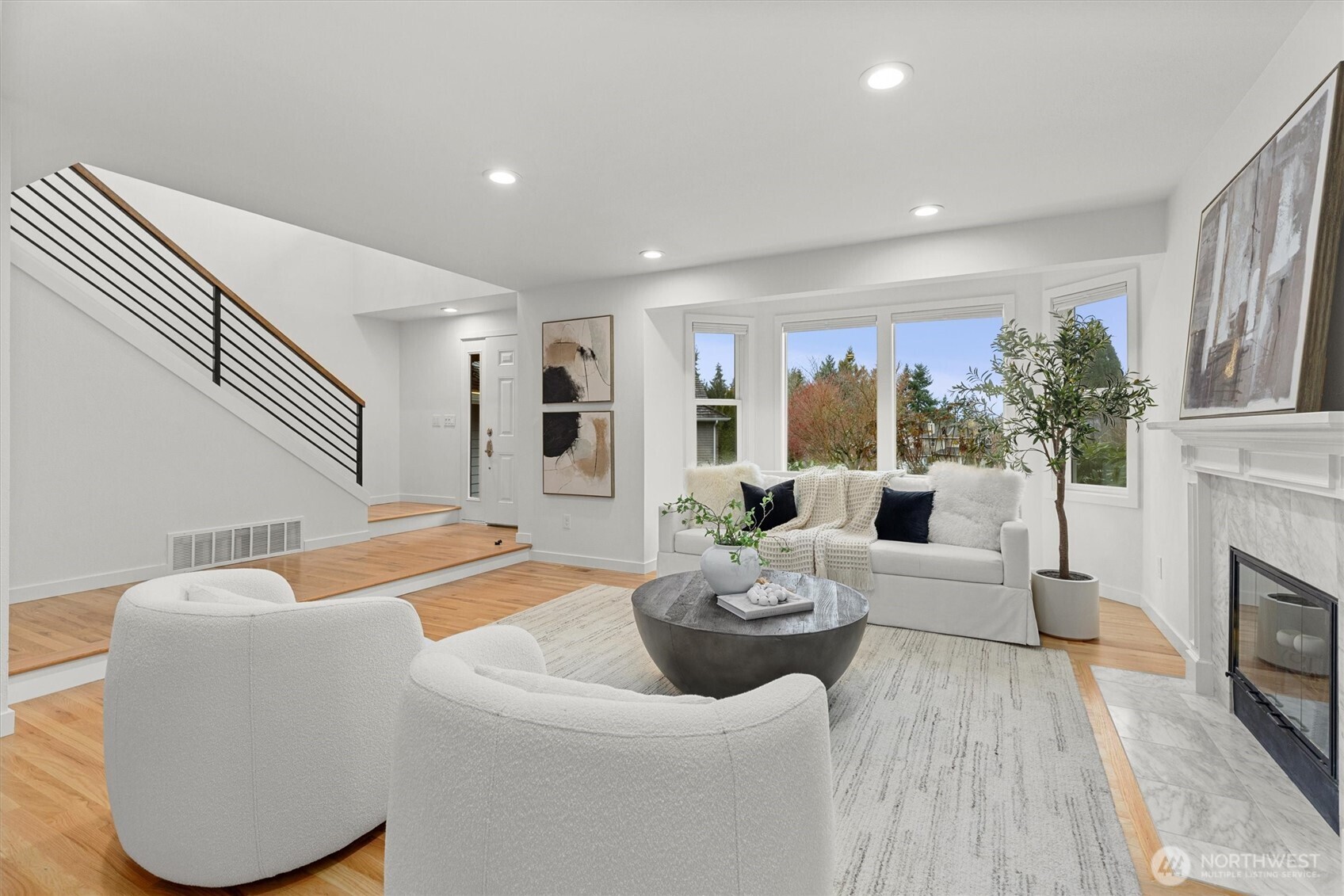 16302 123rd Place Northeast Bothell, WA 98011 - Photo 4 of 37 a living room with furniture and a fireplace