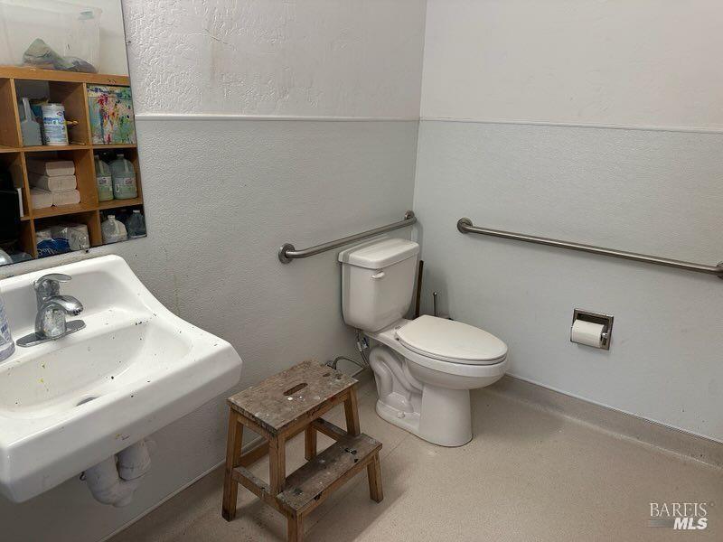 1547 4th Street, Unit A San Rafael, CA 94901 - Photo 13 of 64 a bathroom with a toilet a sink and a mirror
