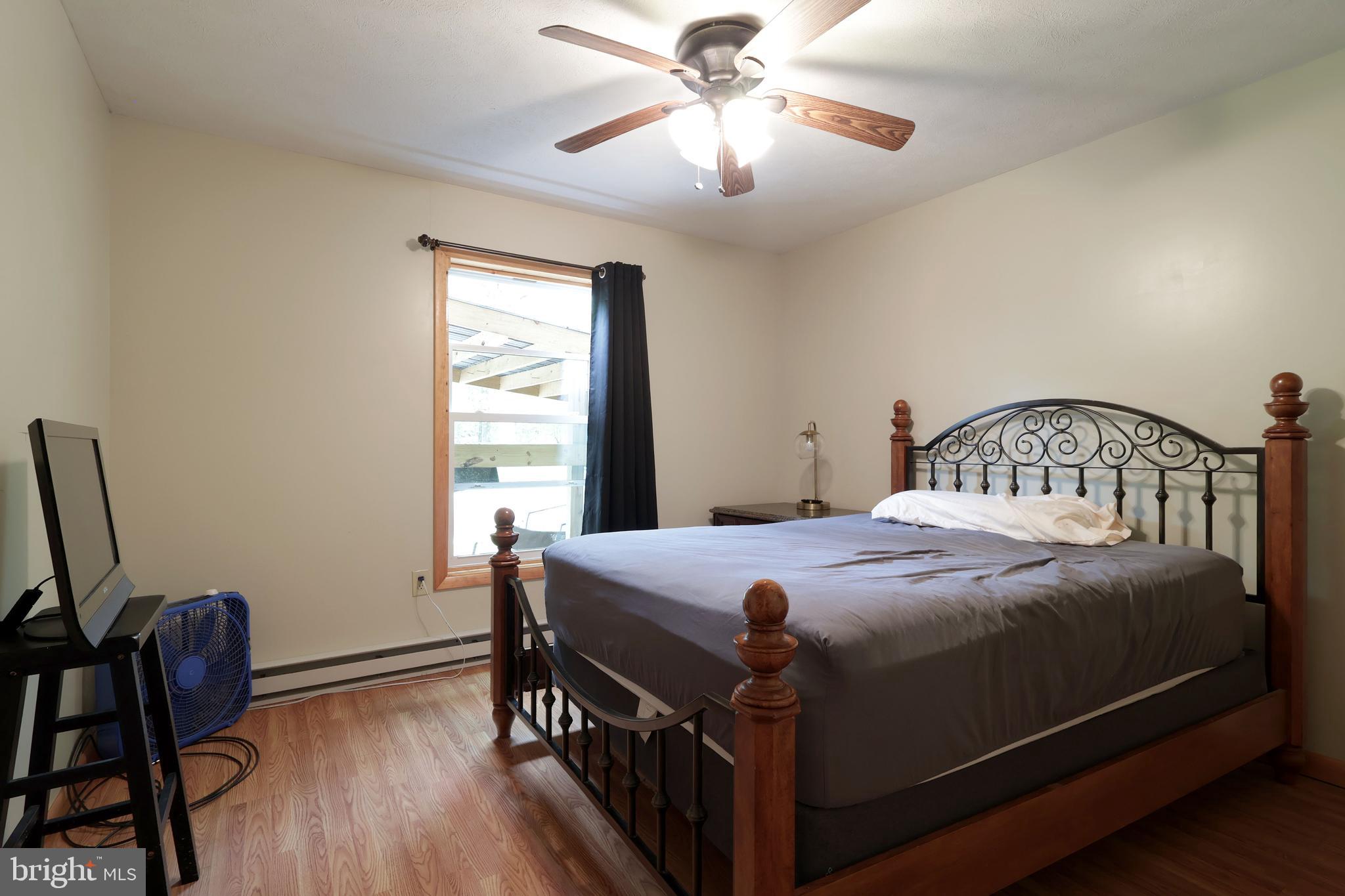 358 Buckridge Road Howard, PA 16841 - Photo 19 of 40 a bedroom with a bed and a window