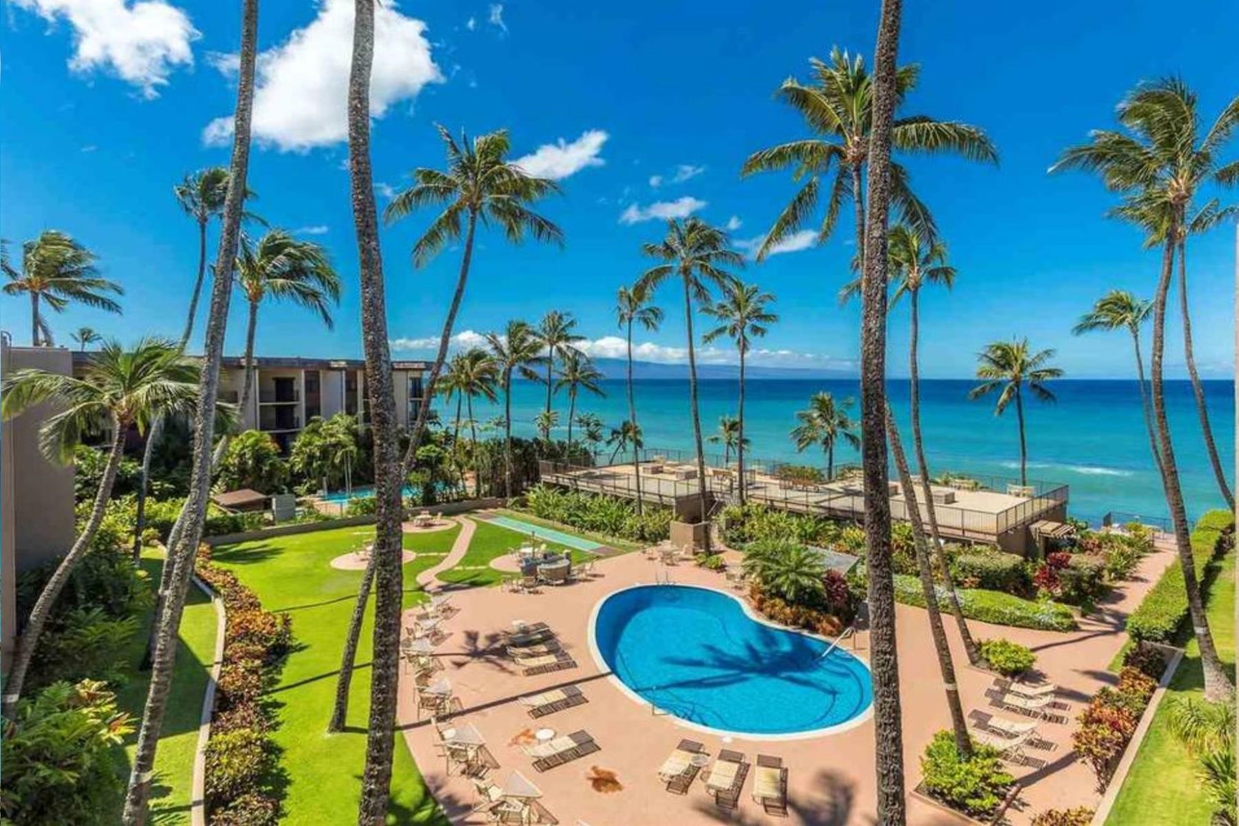 a view of a swimming pool with a patio
