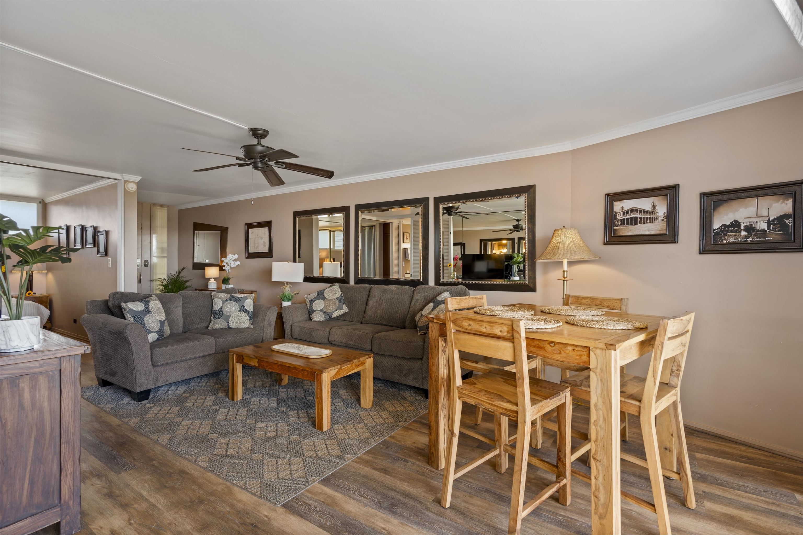 3823 Lower Honoapiilani Road, Unit 401 Lahaina, HI 96761 - Photo 19 of 40 a living room with furniture and a wooden floor