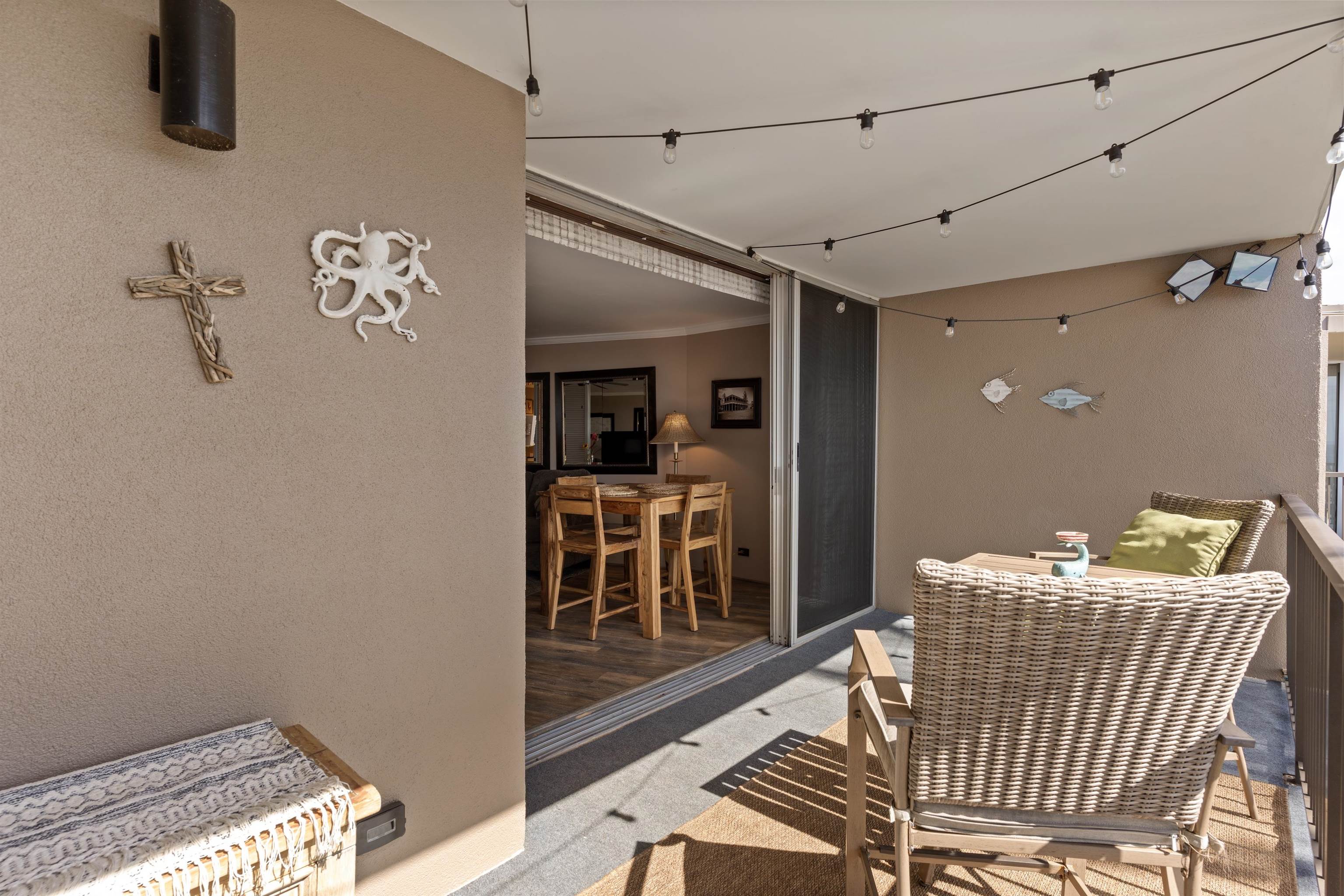 3823 Lower Honoapiilani Road, Unit 401 Lahaina, HI 96761 - Photo 24 of 40 a view of a hallway with seating area