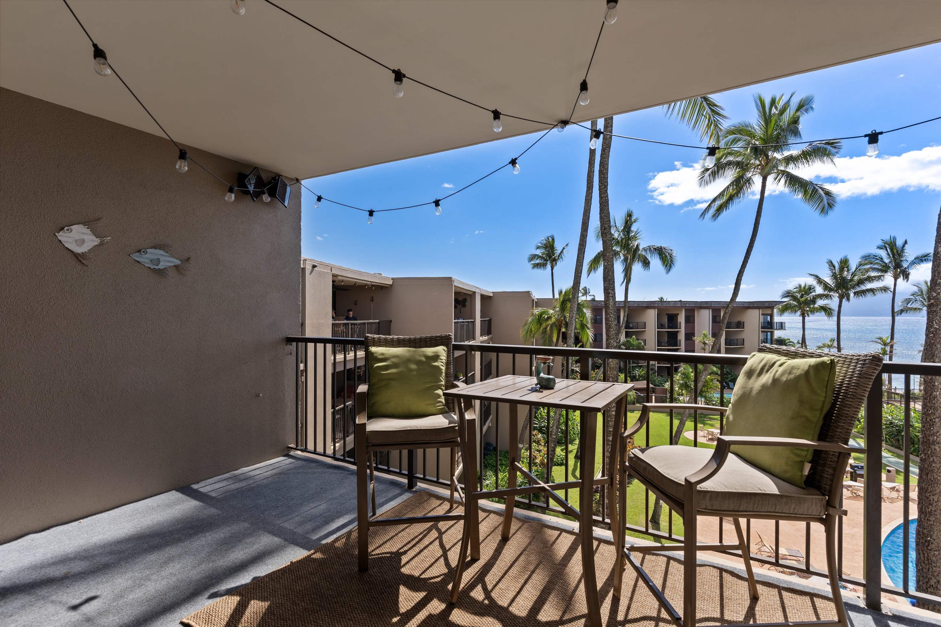 3823 Lower Honoapiilani Road, Unit 401 Lahaina, HI 96761 - Photo 25 of 40 a view of a chairs and table in a room