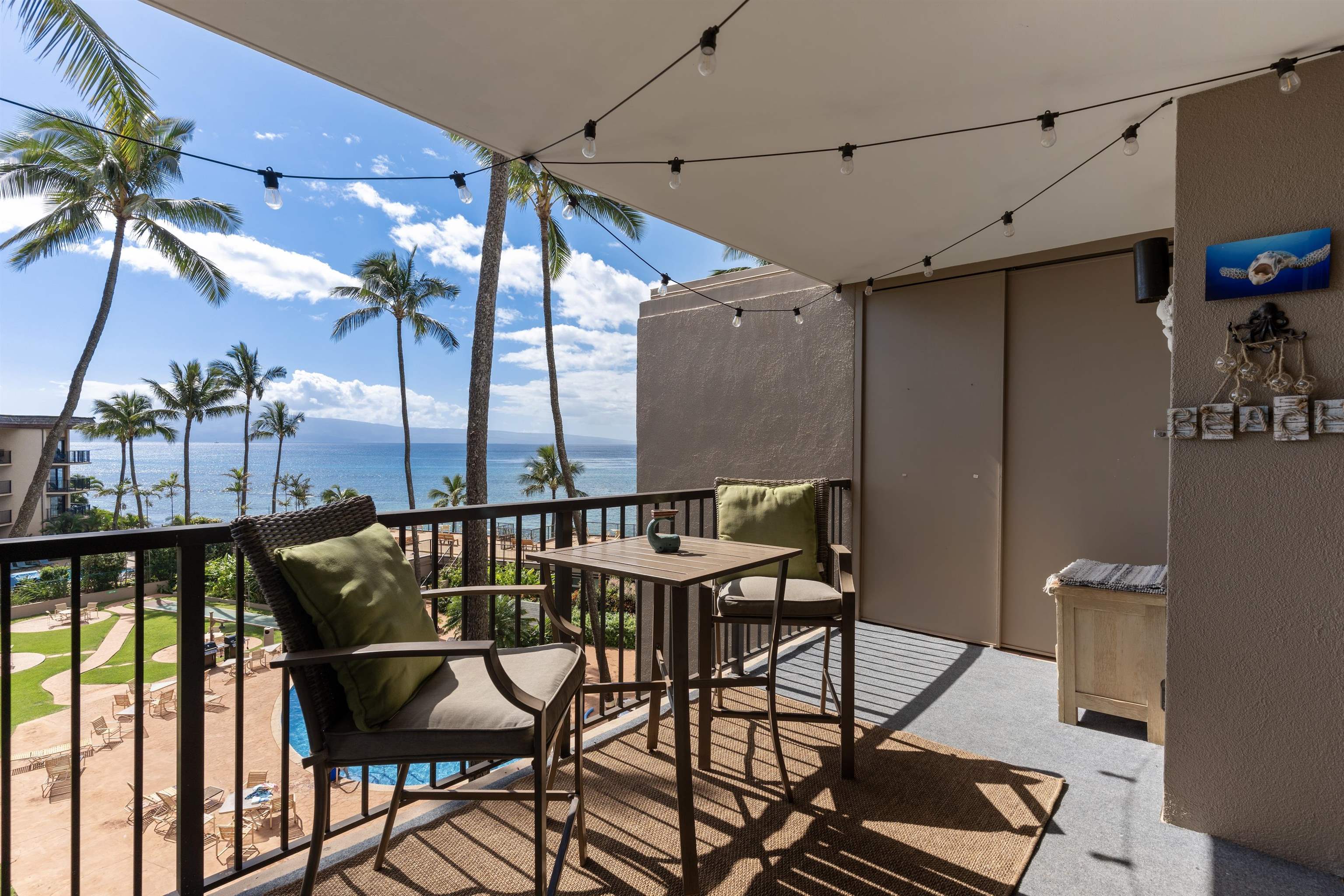 3823 Lower Honoapiilani Road, Unit 401 Lahaina, HI 96761 - Photo 26 of 40 a view of a chairs and table in the balcony