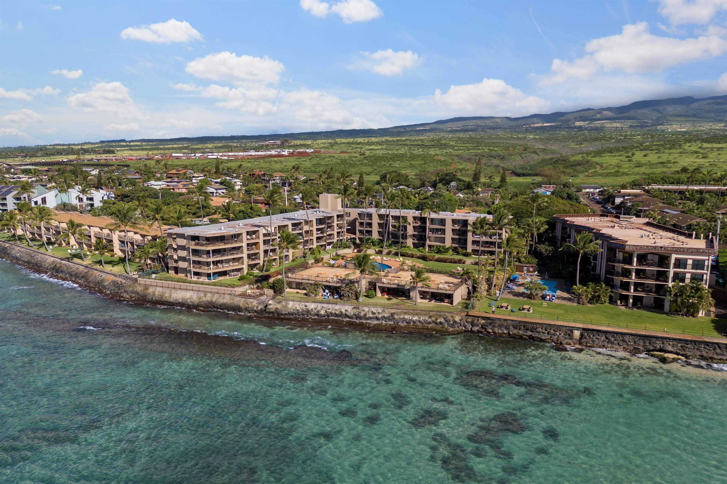 3823 Lower Honoapiilani Road, Unit 401 Lahaina, HI 96761 - Photo 40 of 40 an aerial view of a house with a garden