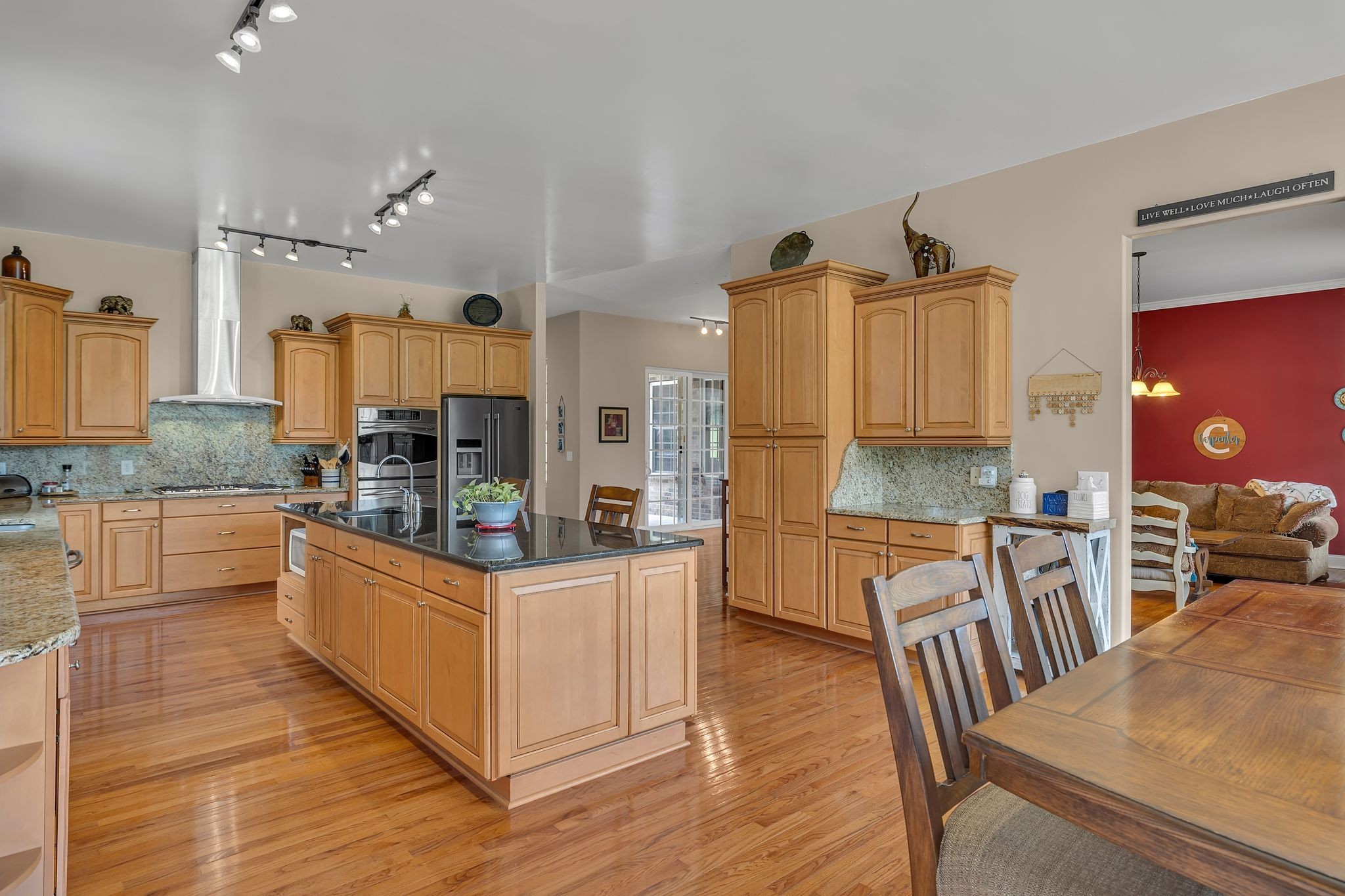 790 Blooming Grove Road Pulaski, TN 38478 - Photo 28 of 74 a kitchen with stainless steel appliances kitchen island granite countertop a stove a sink and a refrigerator