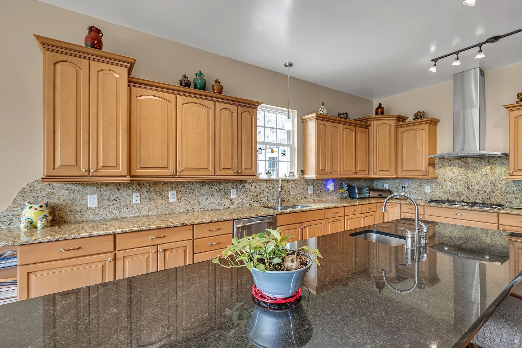 790 Blooming Grove Road Pulaski, TN 38478 - Photo 33 of 74 a kitchen with a stove a sink and a wooden cabinets