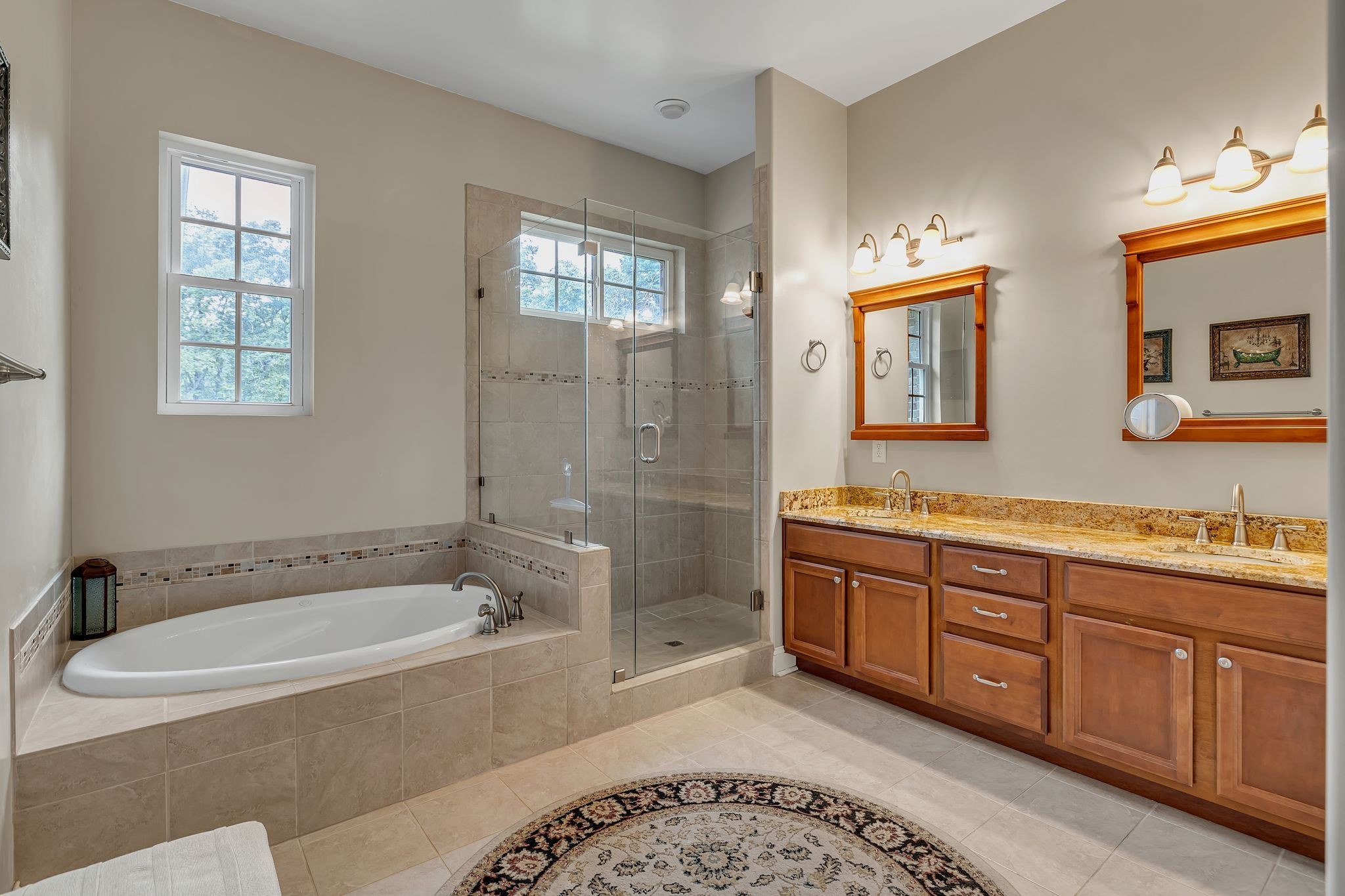 790 Blooming Grove Road Pulaski, TN 38478 - Photo 39 of 74 a spacious bathroom with a granite countertop tub sink and mirror