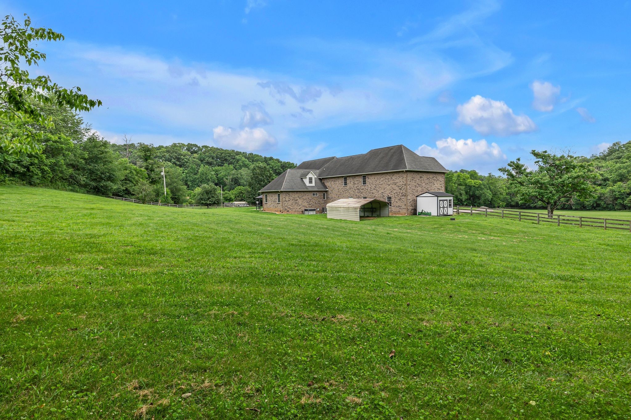 790 Blooming Grove Road Pulaski, TN 38478 - Photo 60 of 67 a view of a garden with a house in the background