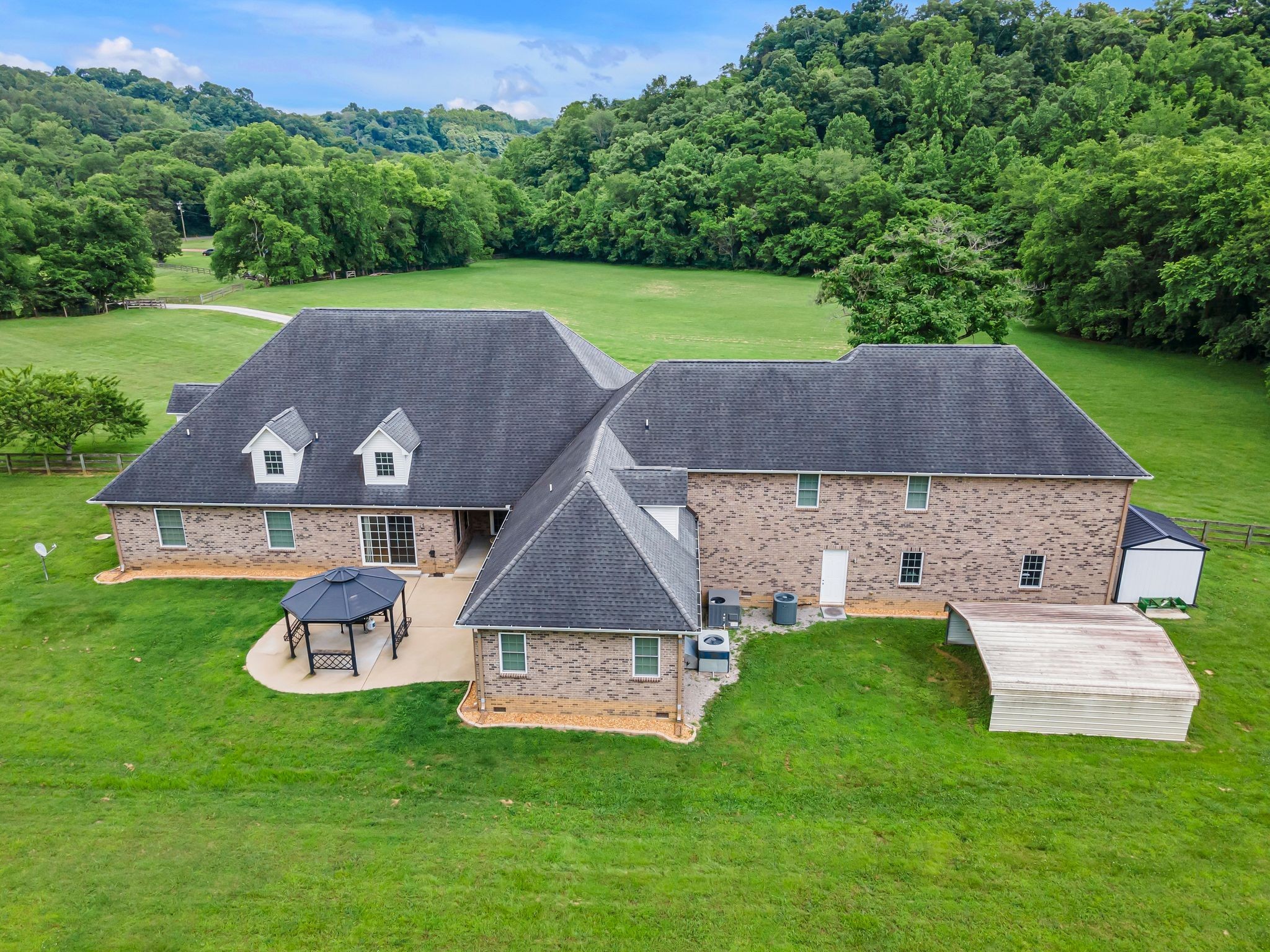 790 Blooming Grove Road Pulaski, TN 38478 - Photo 64 of 67 an aerial view of a house with garden space and a yard