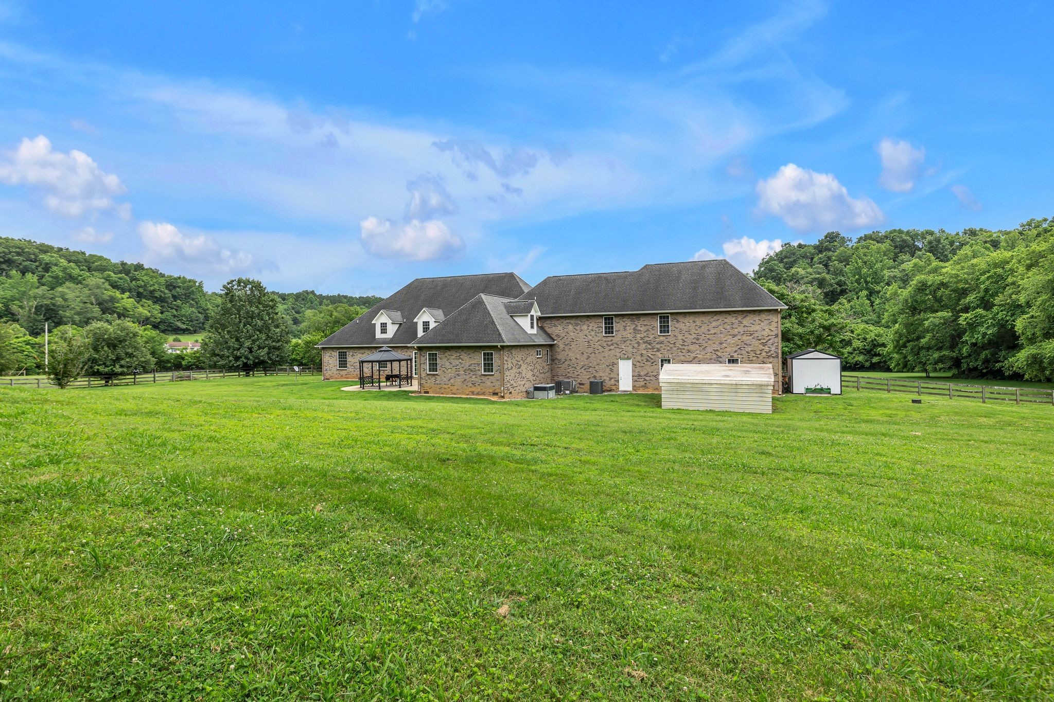 790 Blooming Grove Road Pulaski, TN 38478 - Photo 66 of 74 a view of a house with a big yard plants and large trees