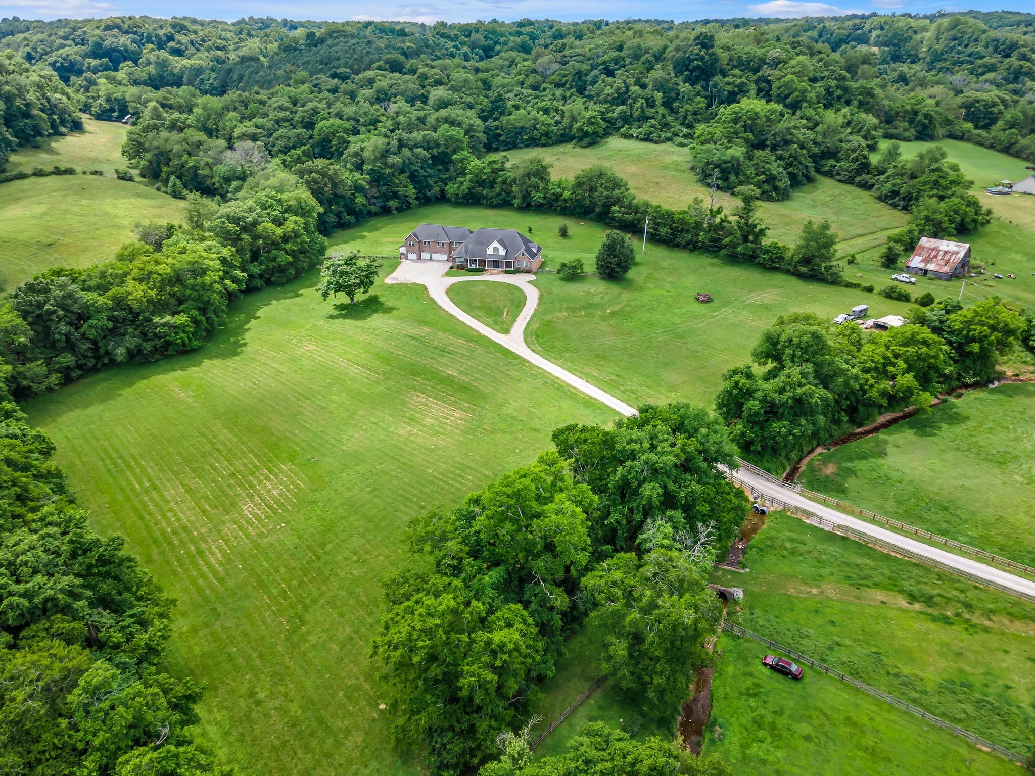 790 Blooming Grove Road Pulaski, TN 38478 - Photo 66 of 67 a view of a green yard with large trees