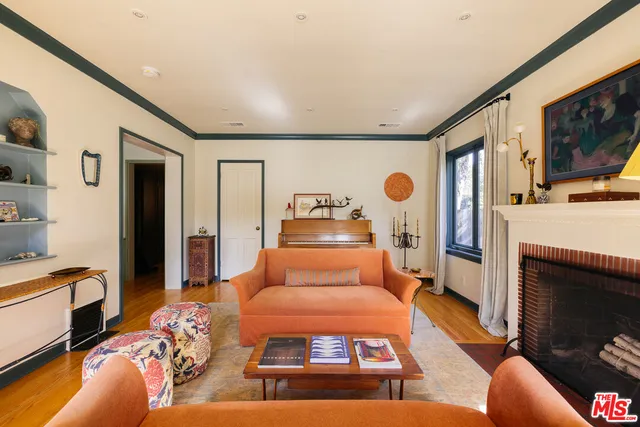a bedroom with furniture and a fireplace