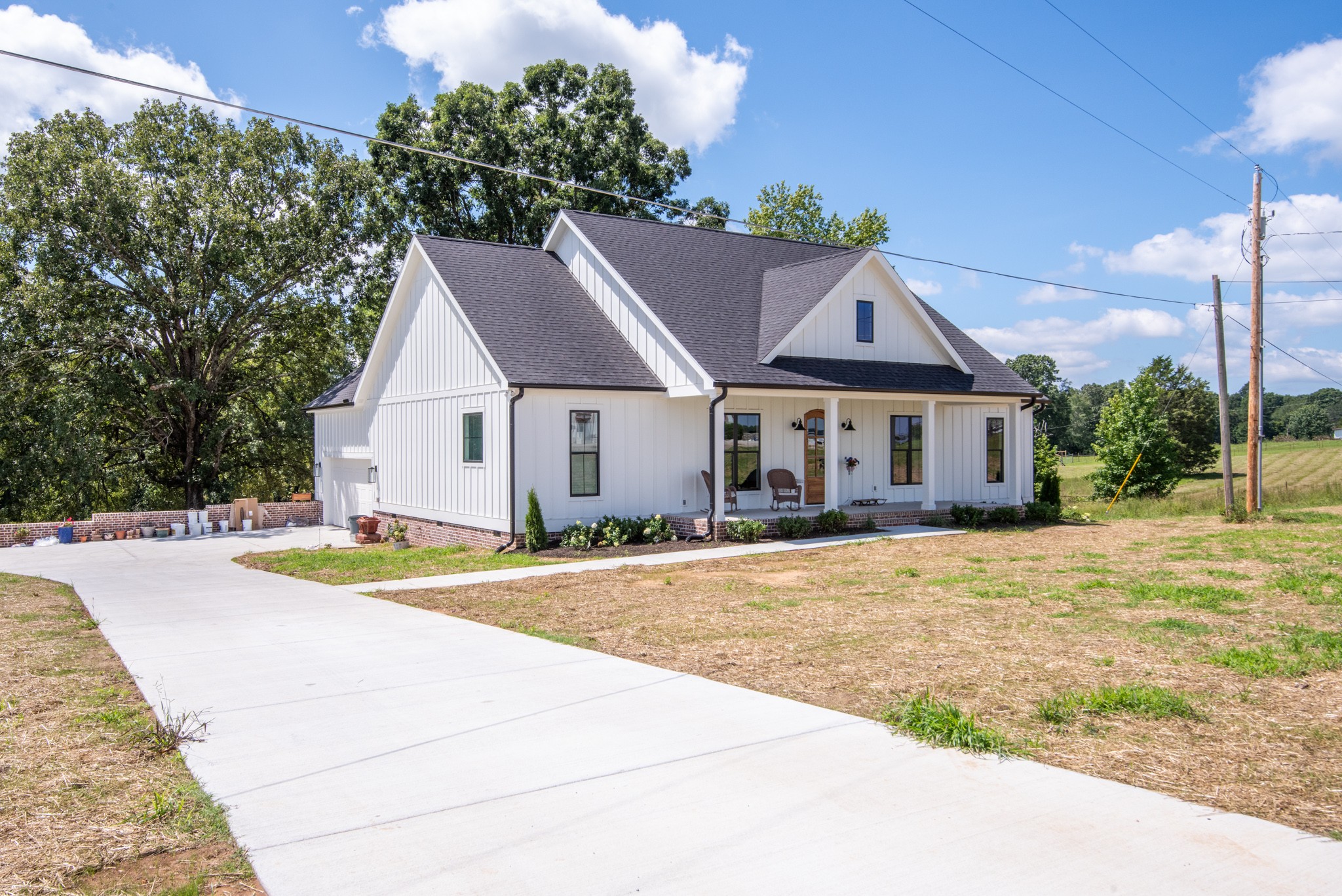 799 Jason Chapel Road Dickson, TN 37055 - Photo 3 of 22 a front view of a house with a yard and garage