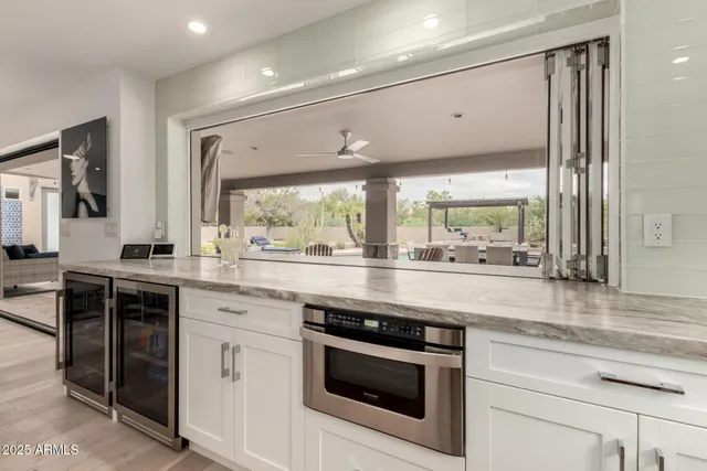 a kitchen with a sink and a stove top oven