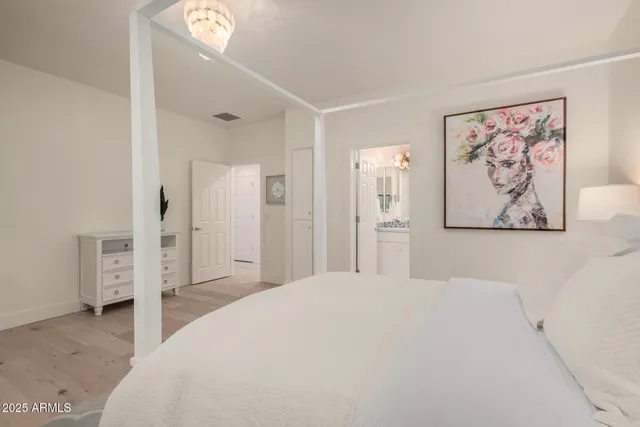 a large white bed in a white room