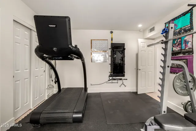 a view of entryway with furniture and wooden floor