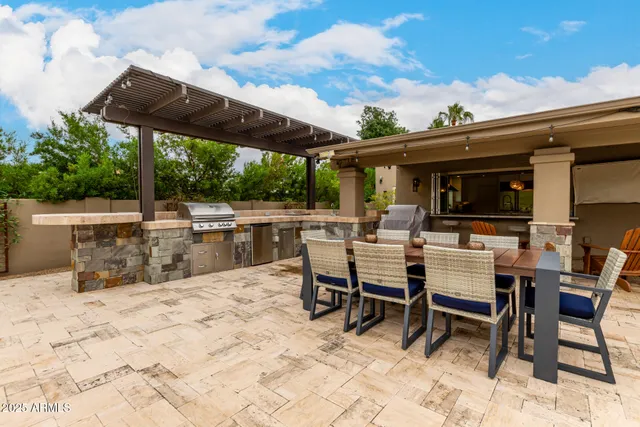 a view of a backyard with sitting area