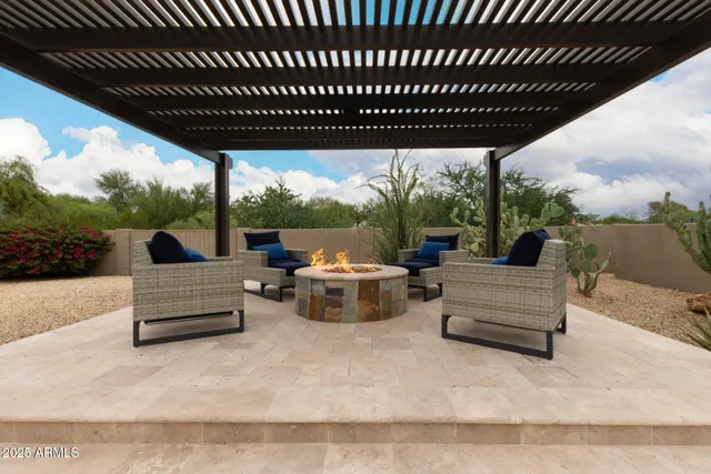 a view of a patio with a table chairs and a patio