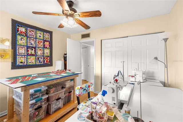 a bathroom with a granite countertop sink a toilet and a mirror