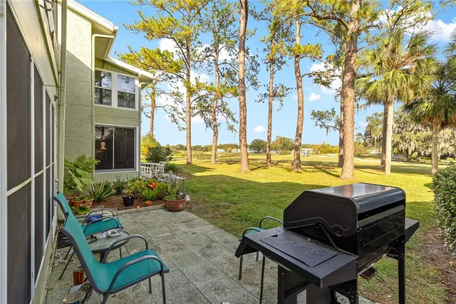 a view of a building with a table and chairs