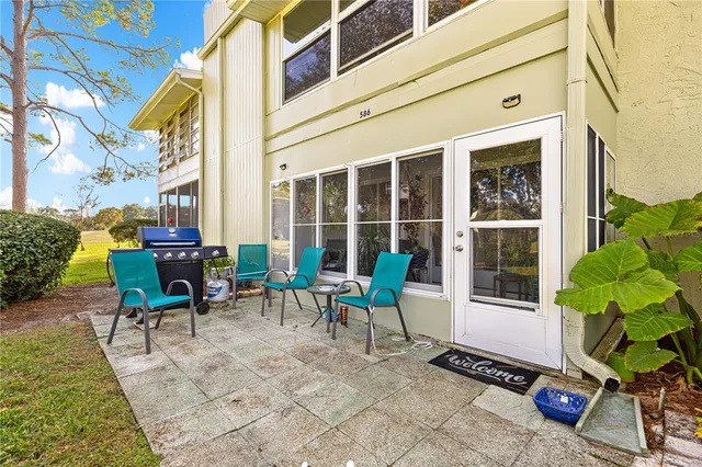 an aerial view of residential houses with outdoor space and street view