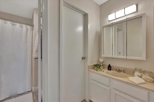 a bathroom with a sink and mirror