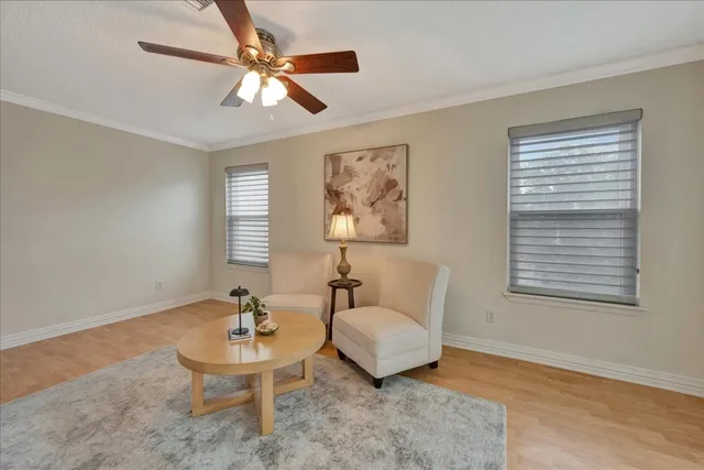 a view of a dining room with furniture and wooden floor