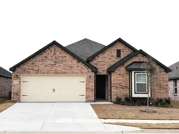 a front view of a house with garage