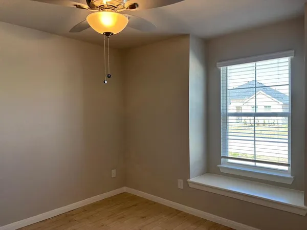a spacious bathroom with a granite countertop sink a mirror and a shower