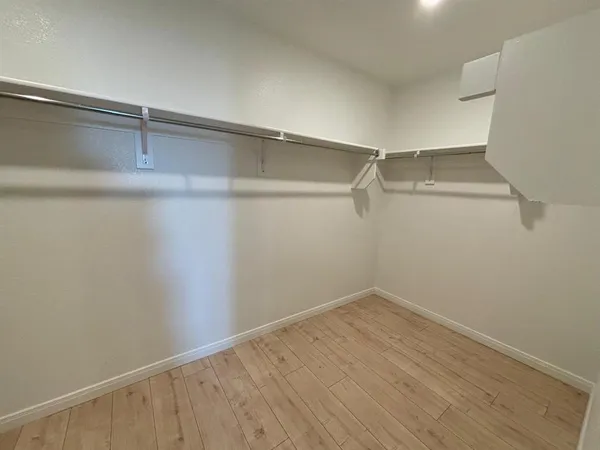 a bathroom with a granite countertop sink mirror and shower