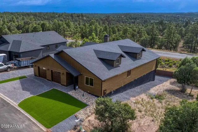 a aerial view of a house with a yard
