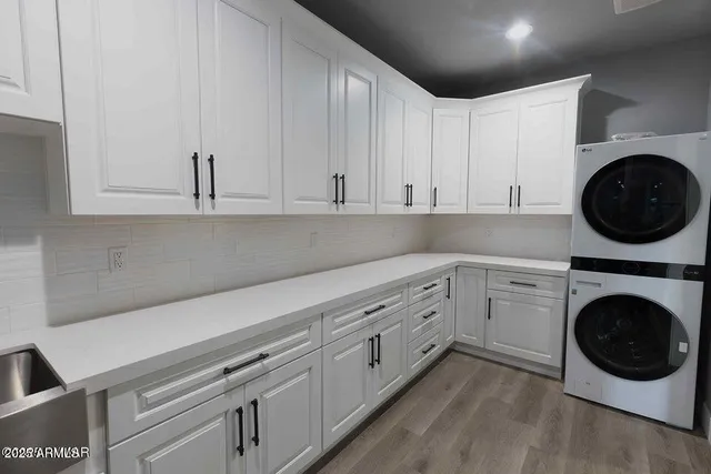 a view of a kitchen with washer and dryer