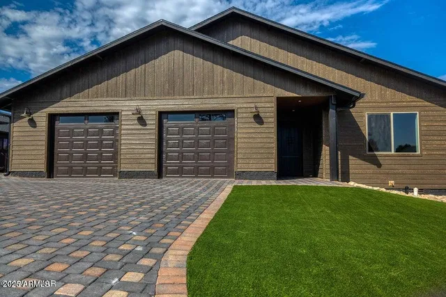 a front view of a house with garage