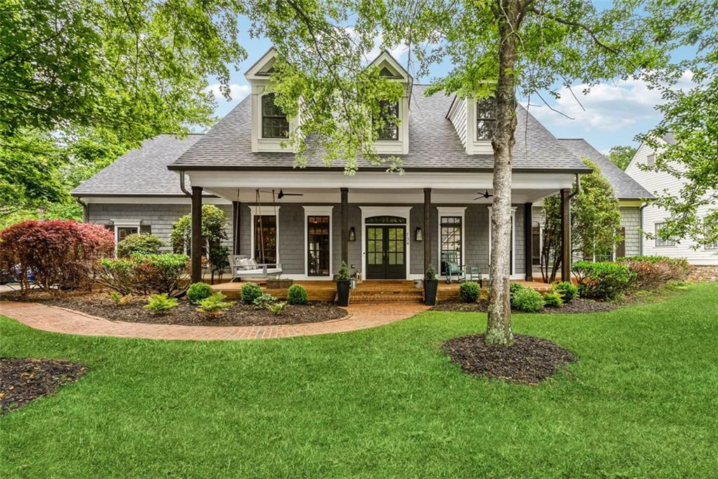 134 Prospector Ridge Dahlonega, GA 30533 - Photo 1 of 1 a front view of a house with a yard table and chairs