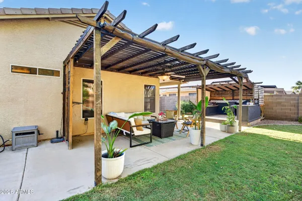 a view of a backyard with sitting area and furniture