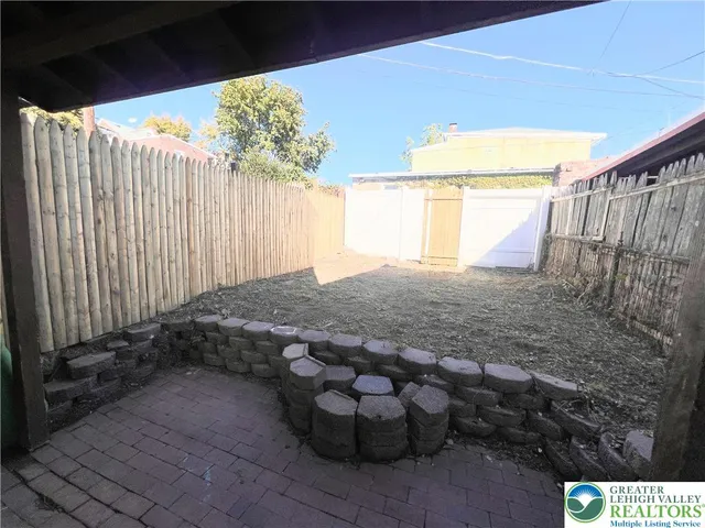 a view of a backyard of the house