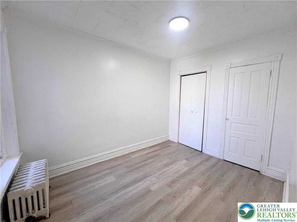 215 South Franklin Street Allentown, PA 18102 - Photo 9 of 13 a view of an empty room and wooden floor