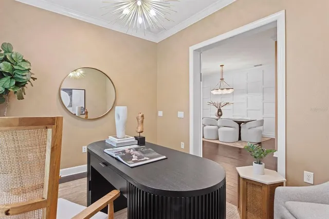a dining room with furniture and window