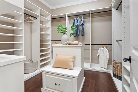 an empty room with closet area