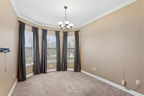 a utility room with cabinets washer and dryer